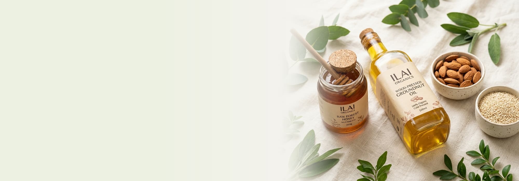 Pure organic products – wood pressed groundnut oil, raw forest honey, whole almonds, sesame seeds and botanical leaves